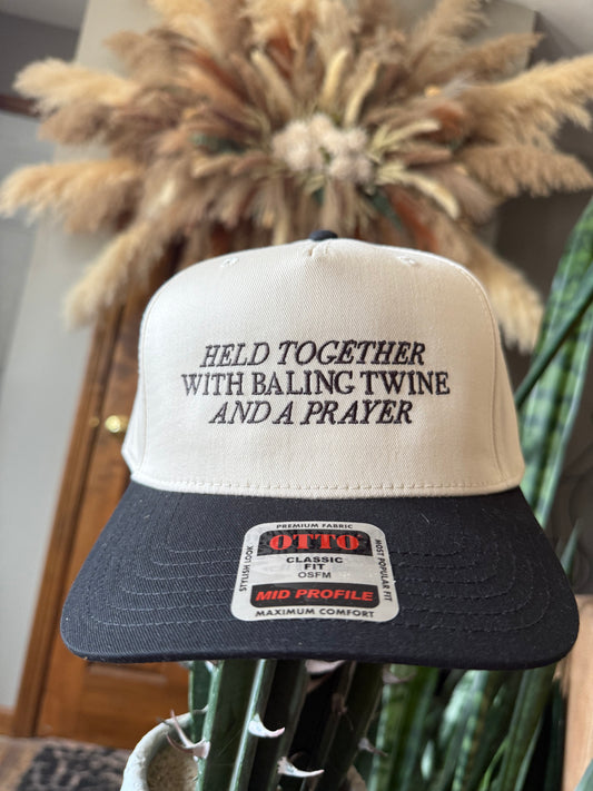 Held Together With Baling Twine And A Prayer Trucker Hat